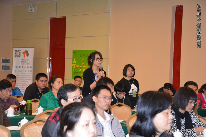 A delegate from NGO asks questions in the symposium