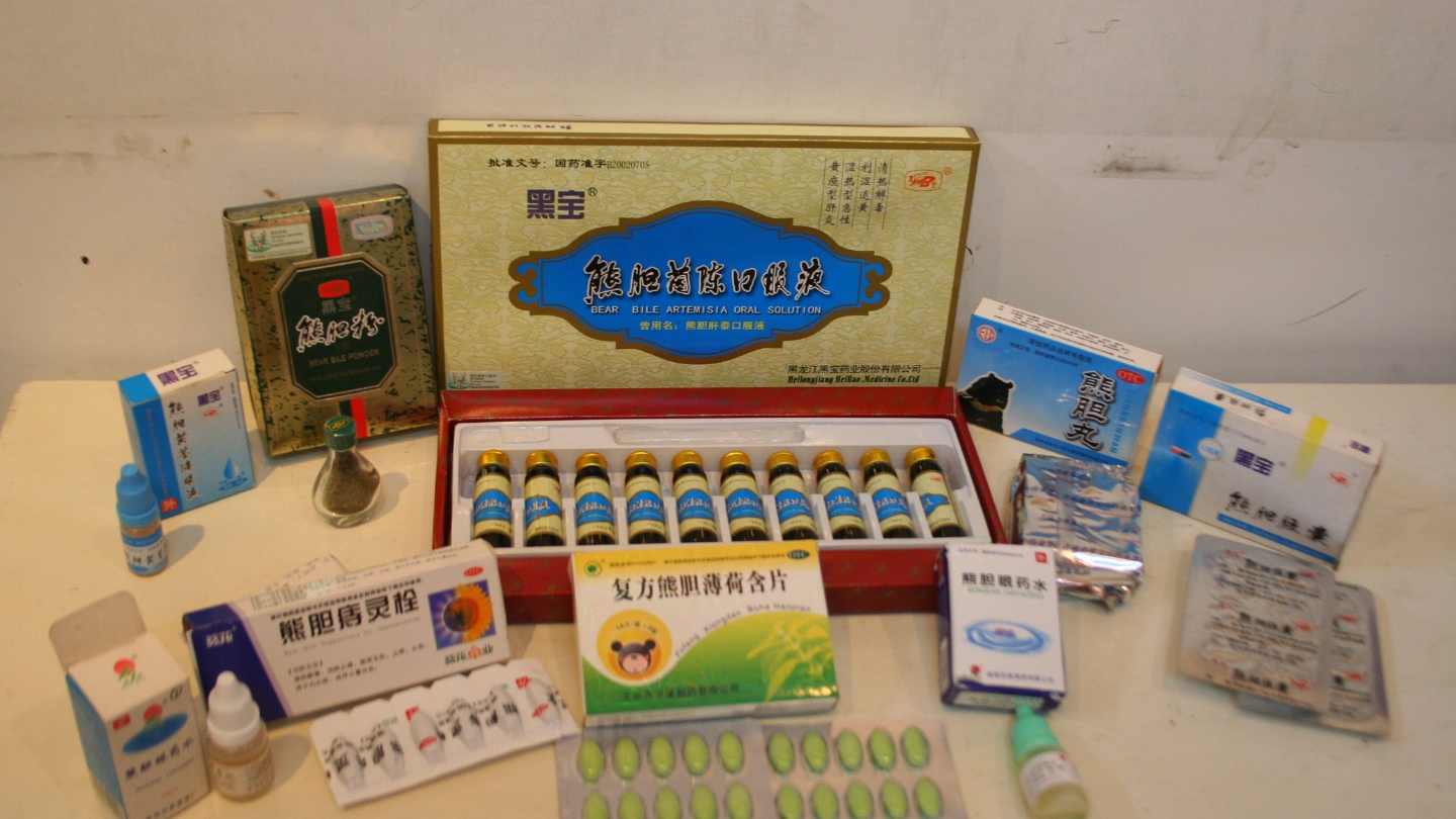 A spread of products containing bear bile in small packages and vials
