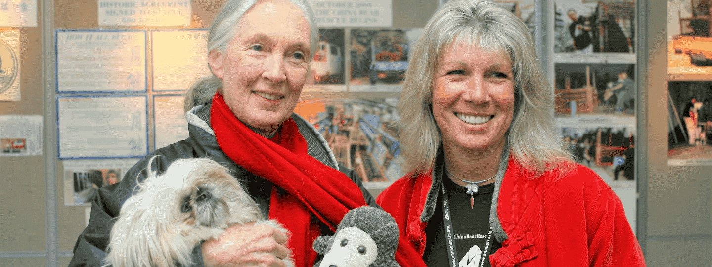 Jane Goodall and Jill Robinson stand next to each other smiling